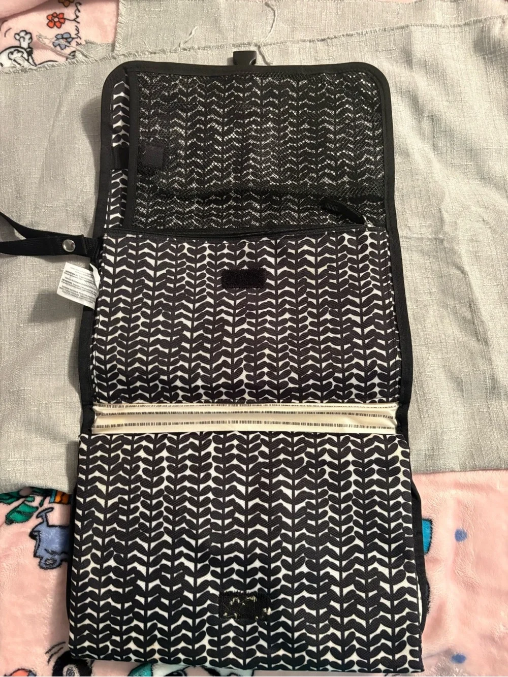 Skidaddle by Skip Hop Black & White Travel diaper bag with fold out changing pad